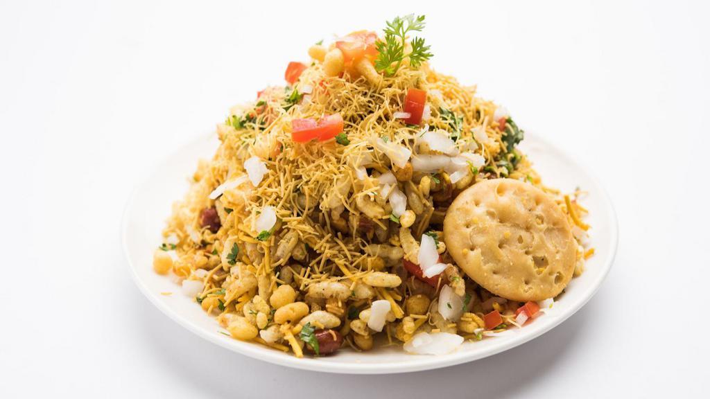 Bhel Puri · Crispy rice puffed with onions, potatoes, coriander, and chutney.