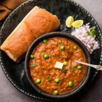 Pav Bhaji · Mixed vegetables prepared in a spicy curry of tomatoes, onion, and ginger. Served with bread.