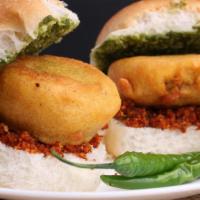 Vada Pav · Deep-fried potato patties and lightly toasted buns. Served with garlic, green, and red chutn...