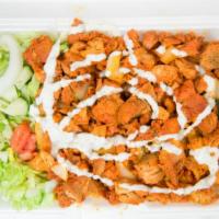 Chicken Over Rice · Grilled Onions, Green Peppers, Lettuce, Tomatoes, White Sauce, Mild or Spicy