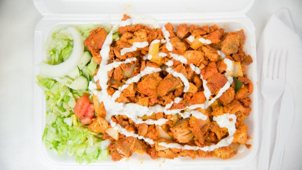 Chicken Over Rice · Grilled Onions, Green Peppers, Lettuce, Tomatoes, White Sauce, Mild or Spicy