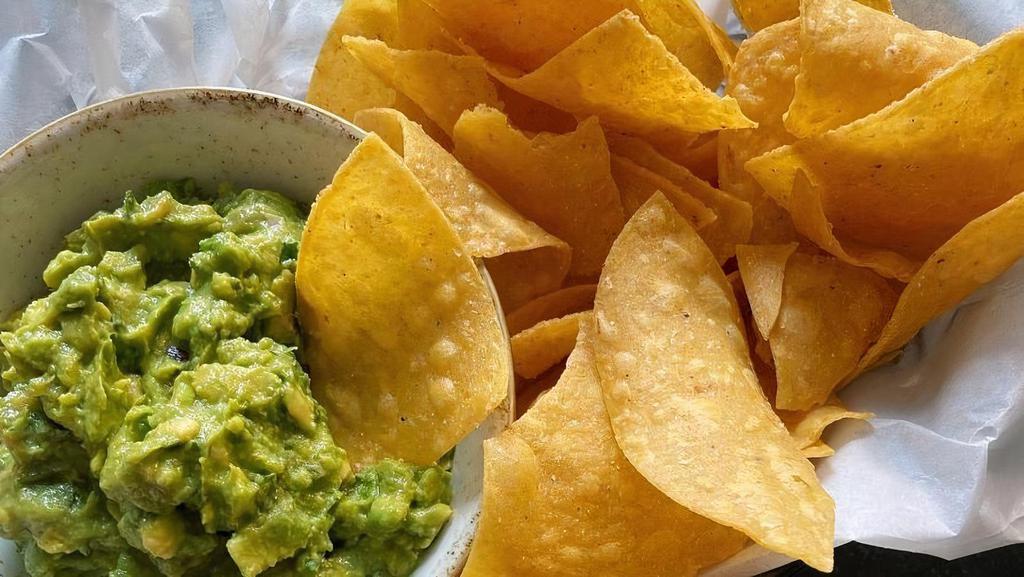 House-Made Chips & Guacamole · house-made corn tortilla chips with fresh guacamole. gluten free + vegan.