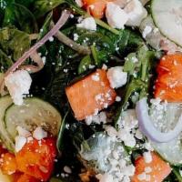 Watermelon + Feta Salad · baby spinach, feta cheese, watermelon, cucumber, red onion, mint, basil, serrano-balsamic vi...