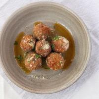 Arancini · six porcini-risotto “palle”, melted mozzarella center, truffle-honey glaze