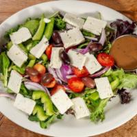 Greek Salad · Favorite. Mixed greens, tomatoes, red onions, green peppers, Kalamata olives, Feta and balsa...