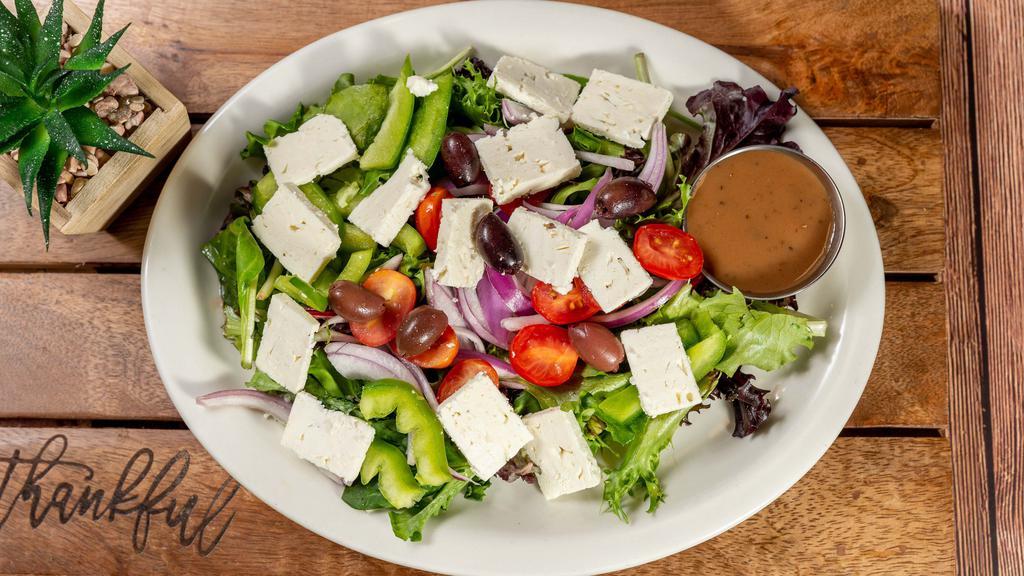Greek Salad · Favorite. Mixed greens, tomatoes, red onions, green peppers, Kalamata olives, Feta and balsamic vinaigrette.
