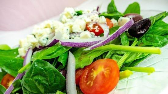 Spinach Salad · Fresh baby spinach, tomatoes, red onions, Kalamata olives, gorgonzola and balsamic vinaigrette.