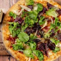 Pizza Prosciutto · Fresh mozzarella, prosciutto and caramelized onions topped with mixed greens and drizzled wi...