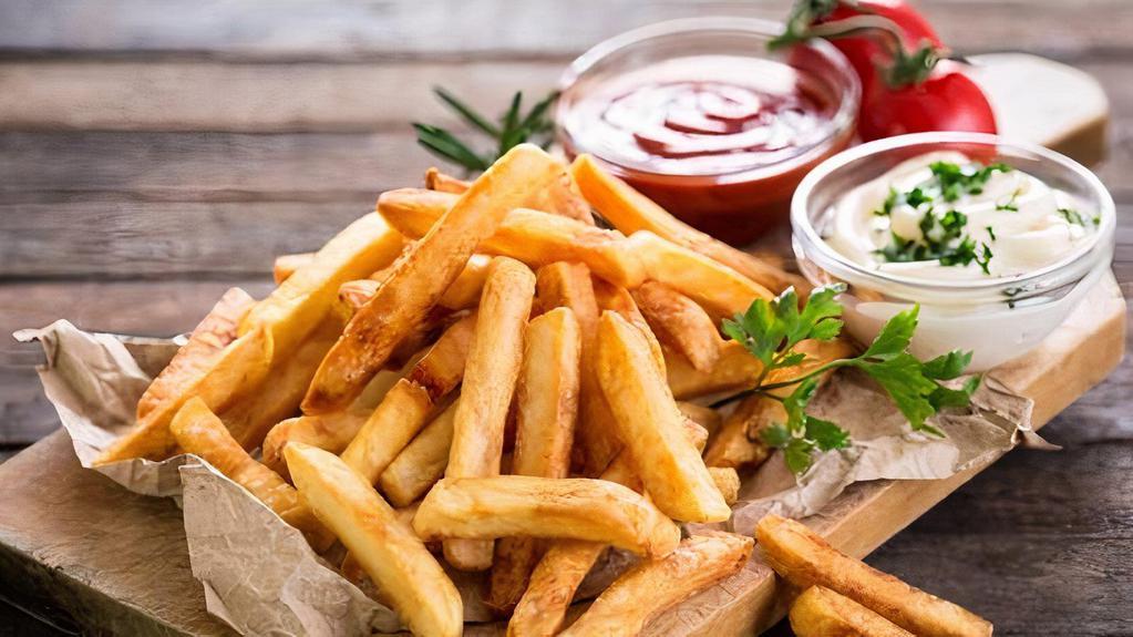 French Fries · Golden crispy hand cut potatoes deep fried.