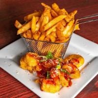 Thai Chili Shrimp · 8 wild caught shrimp drizzled with sweet and spicy sauce, topped with scallions and sesame s...