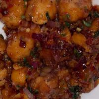 Gobhi Manchurian (Cauliflower) · Battered and deep fried tossed with a traditional brown sauce made from dark soya sauce, vin...