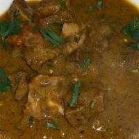 Goat Curry · With bone. Fresh goat meat cooked with onions, fresh ginger, garlic and spices.