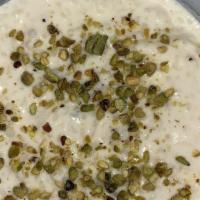 Kheer · Rice pudding flavored with almonds, cashews, golden raisins, and cardamom.