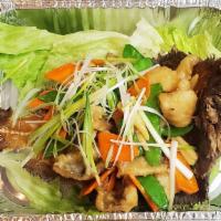 Flounder Duet · Flounder filet with vegetables. Served on the flounder bone in the shape of a boat. Come wit...