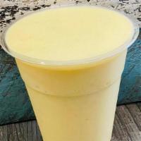 Pineapple Mango Banana · Pineapples, Mango and Banana blended with Coconut Milk, topped with whipped cream