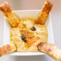 Hummus · Served with crispy afghan naan.