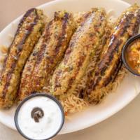 Chicken Seekh Kabob · Flame grilled skewers of house ground chicken mixed with vegetables and seasoning. Served wi...