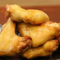 Fried Chicken Wings · Cooked wing of a chicken coated in sauce or seasoning.
