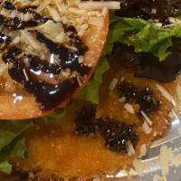 Joe The Boss Chicken · Lightly breaded chicken topped with spring mix, tomatoes and homemade balsamic glaze.
