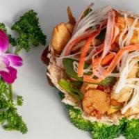 Seafood In Bird Nest · Jumbo shrimp, sea scallop, calamari, crabmeat, mixed vegetables in fried soft noodle nest wi...