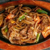 Sizzling Mongolian Beef Or Chicken (Hot & Spicy) · Served with sliced beef or chicken, onion, green pepper in black pepper sauce.
