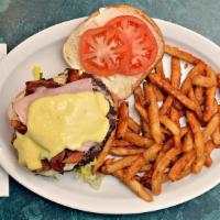 The Beast · Bacon double cheese burger with ham, fried egg, lettuce, tomato, mayo and side of hollandais...