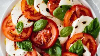 Caprese · Prosciutto di Parma, fresh Mozzarella and tomato over organic mixed greens with a drizzle of...