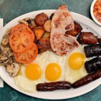 Irish Breakfast · Three eggs, Irish bacon, Irish sausage, grilled mushrooms and tomato, baked beans, black and...