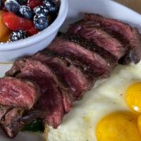 Steak And Eggs · 8oz marinated hanger steak, three eggs your way, sautéed spinach, choice of side, and toast
