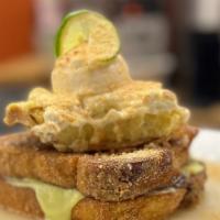 Key Lime Pie French Toast · Two pieces of graham cracker encrusted thick challah bread dipped in our creme brulee batter...