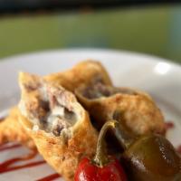 Cheesesteak Egg Rolls · Sliced steak, onions, American cheese in an egg roll wrapper, served with spicy ketchup and ...