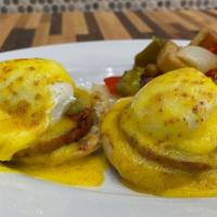 Eggs Benedict · Thick cut Canadian bacon, two eggs, on a toasted English muffin, with hollandaise sauce.
