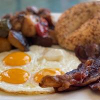 Eggs Your Way · Three farm fresh eggs served with toasted bread and your choice of breakfast meat.