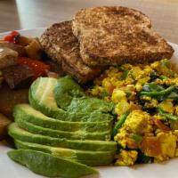 Ultimate Tofu Scramble · Firm tofu, curry, peppers, onions, plum tomatoes, chiffonade of spinach and Avocado, served ...