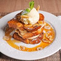 Salted Caramel Banana Stuffed French Toast · Three pieces of thick cut challah bread, dipped in creme brûlée batter, with salted caramel ...