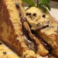 Cookie Dough Stuffed French Toast · Chocolate chip cookie dough stuffed challah bread, topped with 100% maple syrup, vanilla ang...