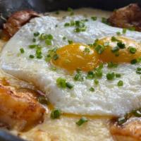 Creole Shrimp & Grits · Seared gulf shrimp cooked in a spicy creole sauce, served on top of stone ground cheesy grit...