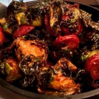 Brussels Sprouts · Mexican chorizo, cherry-chipotle gastrique, crispy sprout leaves.