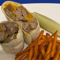 Steak Tips Wrap* · Caramelized onions and cheddar cheese.

These items are served raw or may be
cooked to order...
