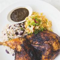 1/2 Jerk Chicken · rice and peas, and stewed cabbage.