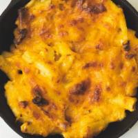 Macaroni Pie · cheddar, and grated onion.