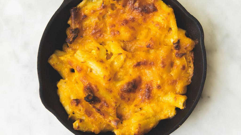 Macaroni Pie · cheddar, and grated onion.