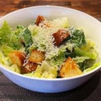 Caesar Salad · Romaine hearts, anchovy dressing, grated parmigiano, croutons.