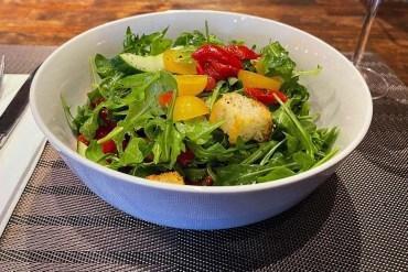 Panzanella · Arugula, roasted red peppers, cucumber, grape tomatoes, croutons.