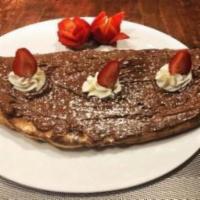 Nutella Pizza · Charcoal Guido’s signature dessert filled with Nutella® and cannoli filling, topped with str...