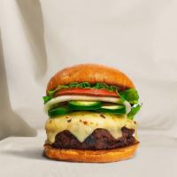 Hola Jalapeño Burger · American beef patty topped with melted pepper jack cheese, jalapenos, lettuce, tomato, onion...