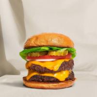 Double Decker Cheese Burger · Two American beef patties topped with melted cheese, lettuce, tomato, onion, and pickles. Se...