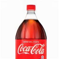 2 Liter Soda · Your choice of 2-liter soda, served cold.