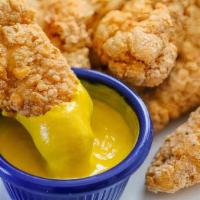 Chicken Fingers · Buttermilk battered, golden brown, chicken tenders with your choice of our delicious dipping...