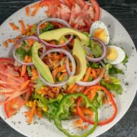 California Cobb Salad · Tomatoes, Avocado, Bacon, Onions, Roasted Corn, Egg, Blue Cheese, Balsamic Vinaigrette, or R...